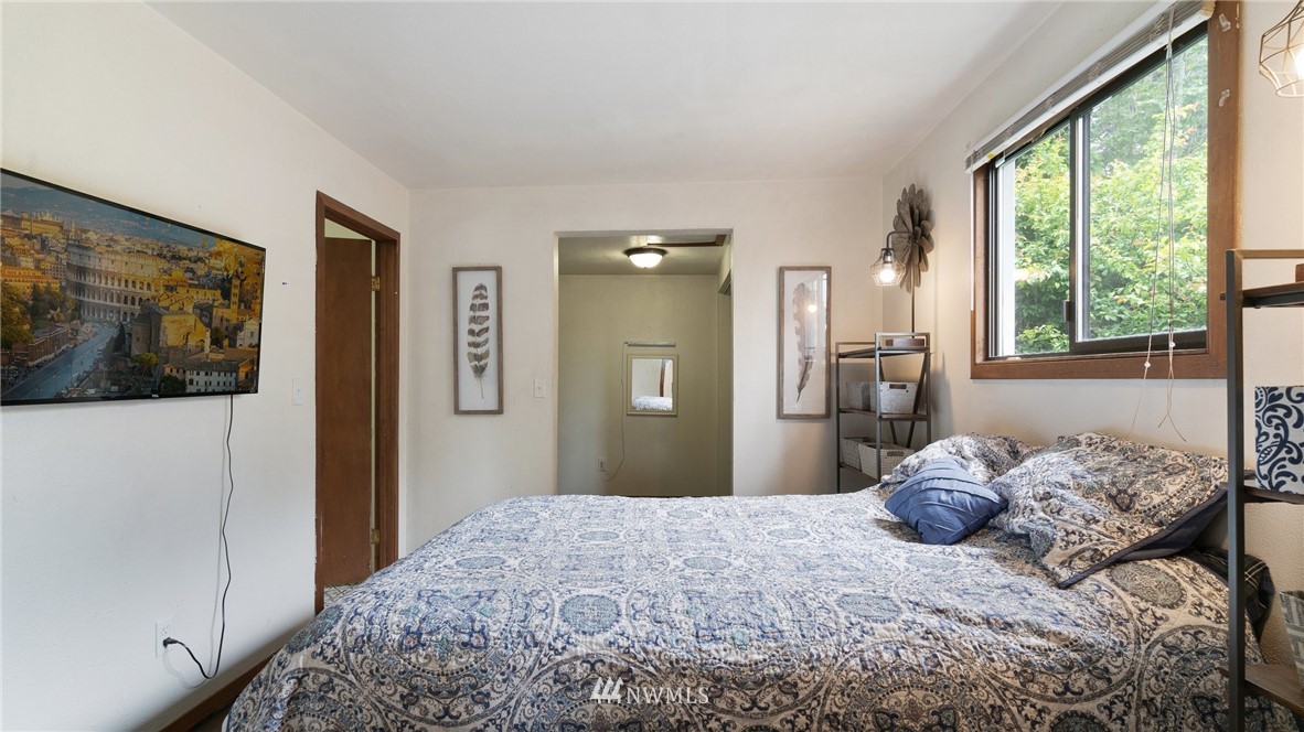 508 Southwest 3rd Place Renton, WA 98057 - Photo 11 of 23 a bedroom with a large bed and a large window