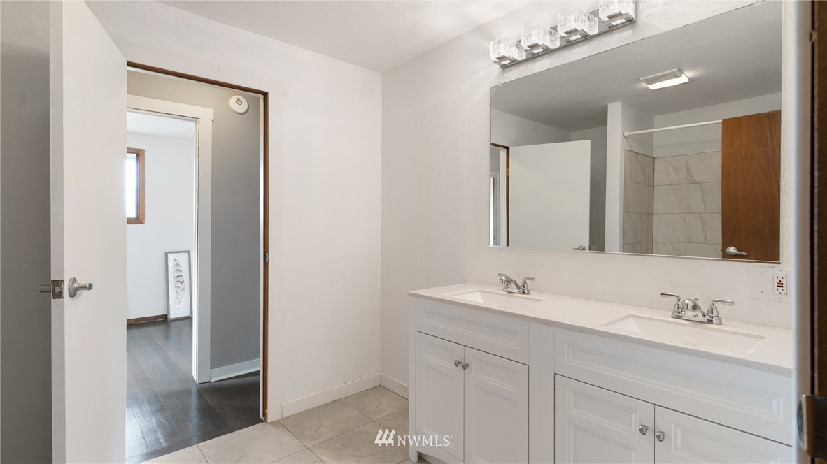 508 Southwest 3rd Place Renton, WA 98057 - Photo 13 of 23 a bathroom with a sink double vanity and a mirror