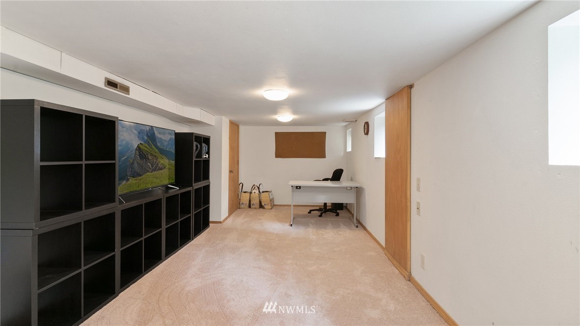 508 Southwest 3rd Place Renton, WA 98057 - Photo 18 of 23 a living room with furniture and a flat screen tv