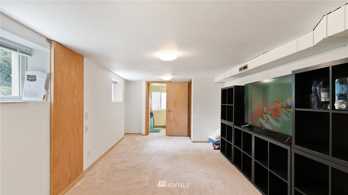 508 Southwest 3rd Place Renton, WA 98057 - Photo 19 of 23 a view of a hallway with flat screen tv