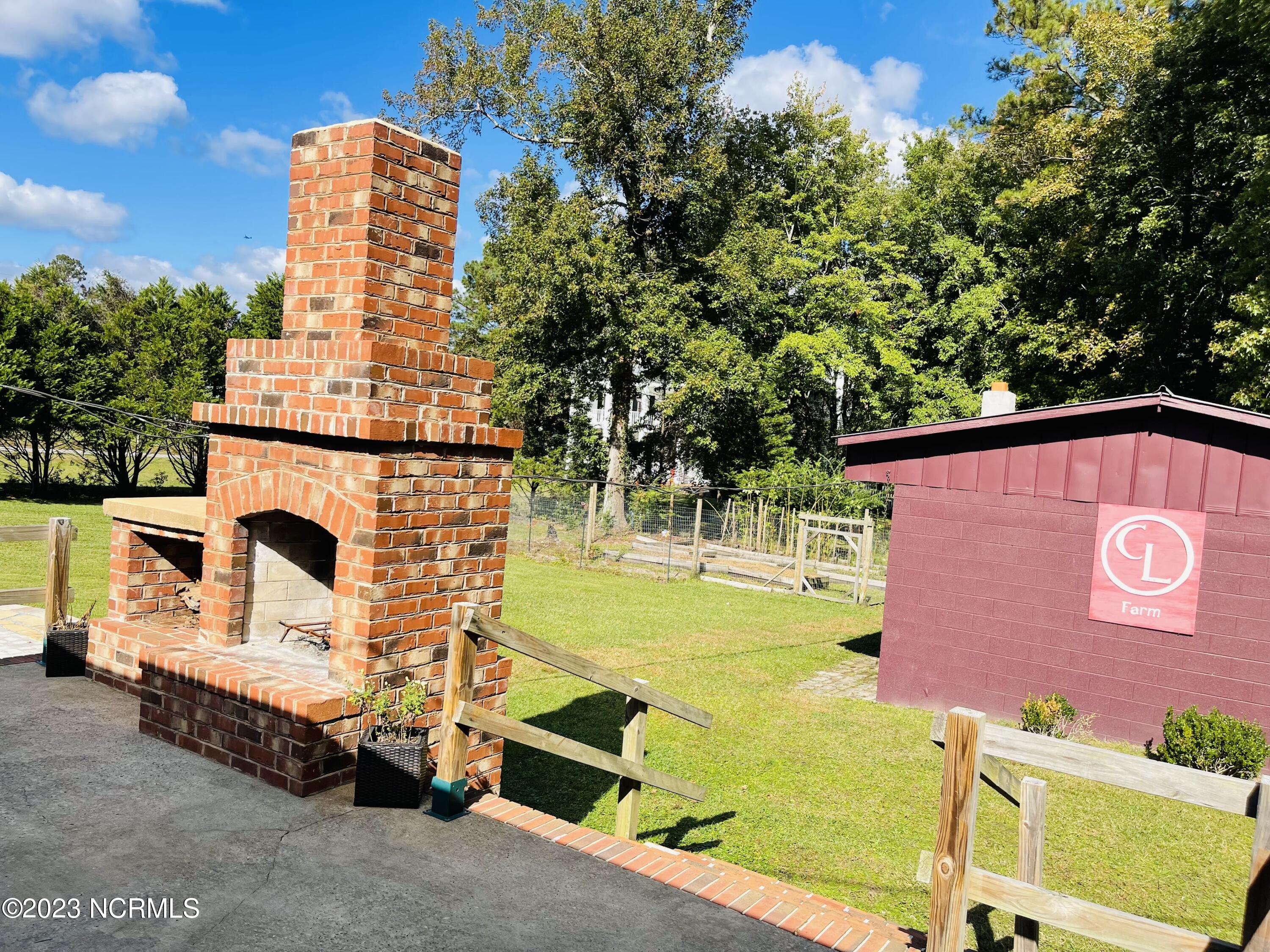 792 Roberts Road Newport, NC 28570 - Photo 5 of 52 Nice custom brick craftsman fireplace and workshop with heating and cooling