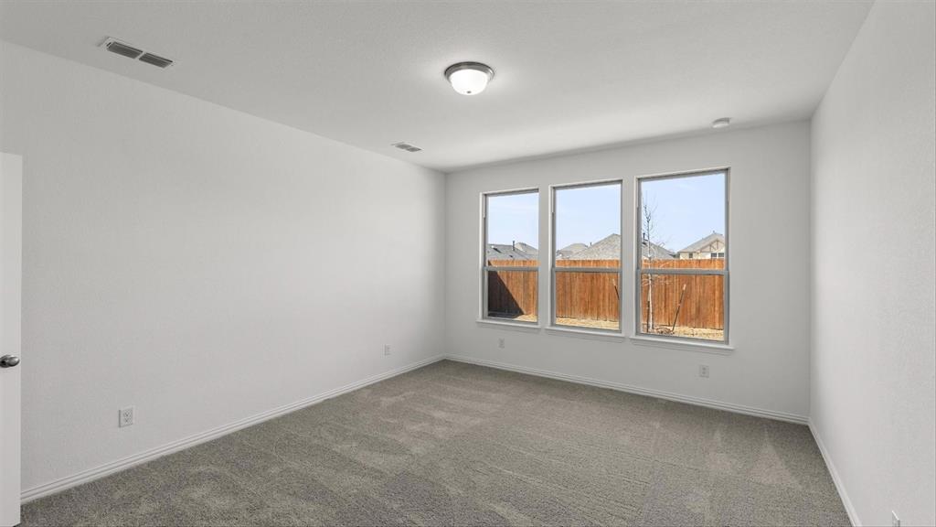 2747 Teton Street Corinth, TX 76210 - Photo 15 of 22 an empty room with a window