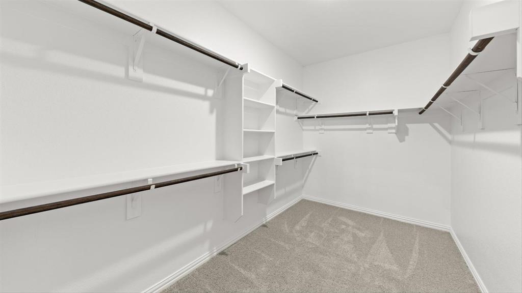 2747 Teton Street Corinth, TX 76210 - Photo 20 of 22 a view of an empty walk in closet