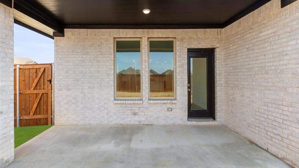 2747 Teton Street Corinth, TX 76210 - Photo 22 of 22 a front view of a house with a yard