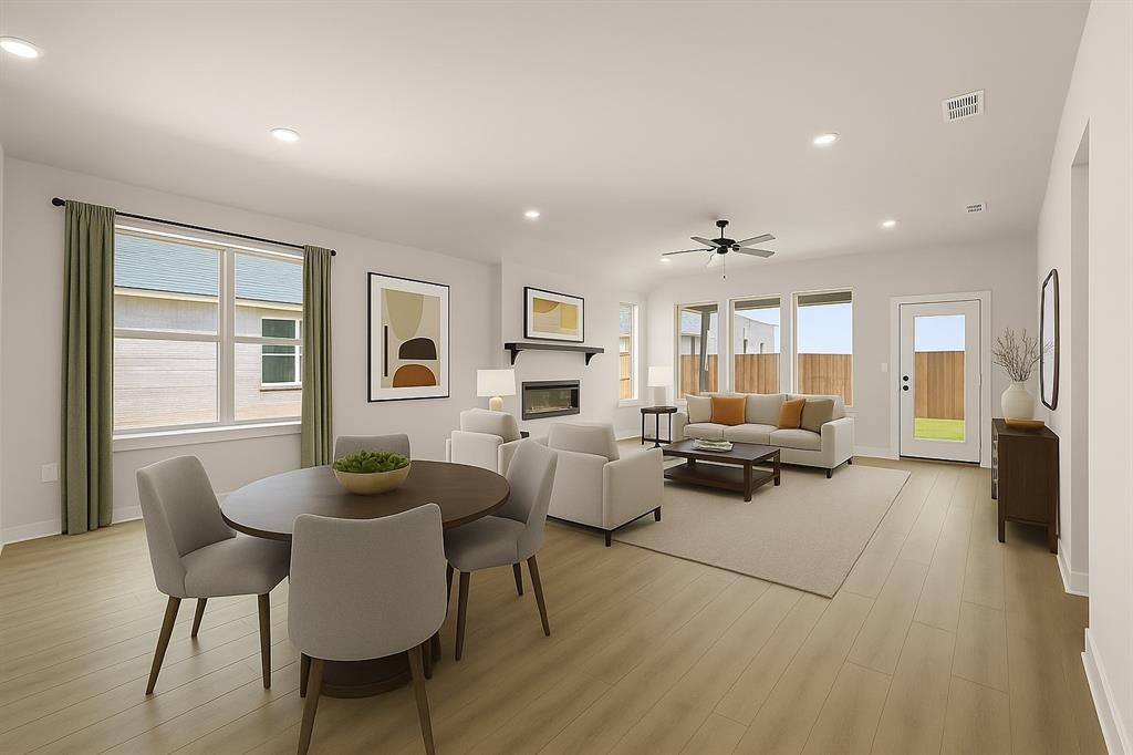 2747 Teton Street Corinth, TX 76210 - Photo 4 of 22 a living room with furniture and a large window