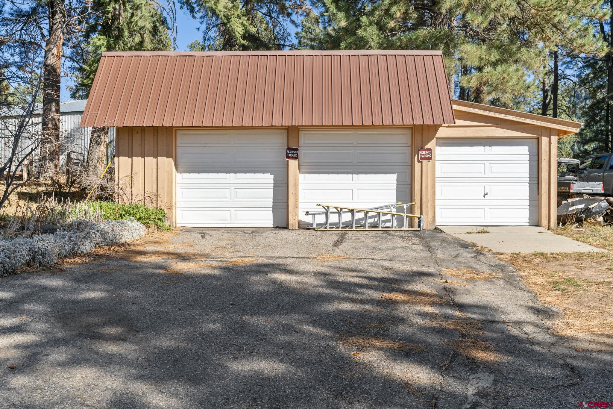 12199 County Road 240 Durango, CO 81301 - Photo 18 of 35 a view of a small house with yard and garage