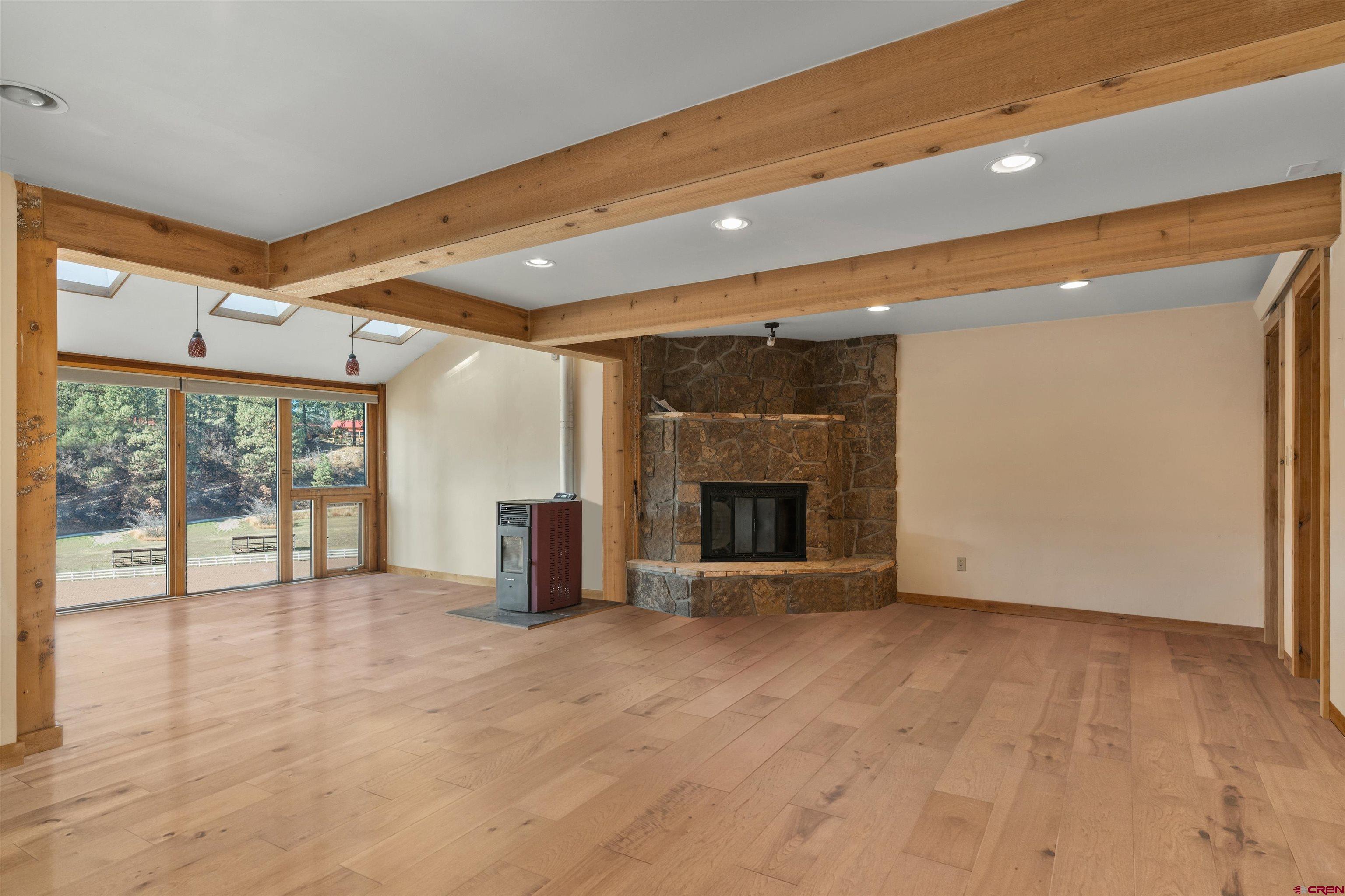 12199 County Road 240 Durango, CO 81301 - Photo 22 of 35 a view of an empty room with a fireplace