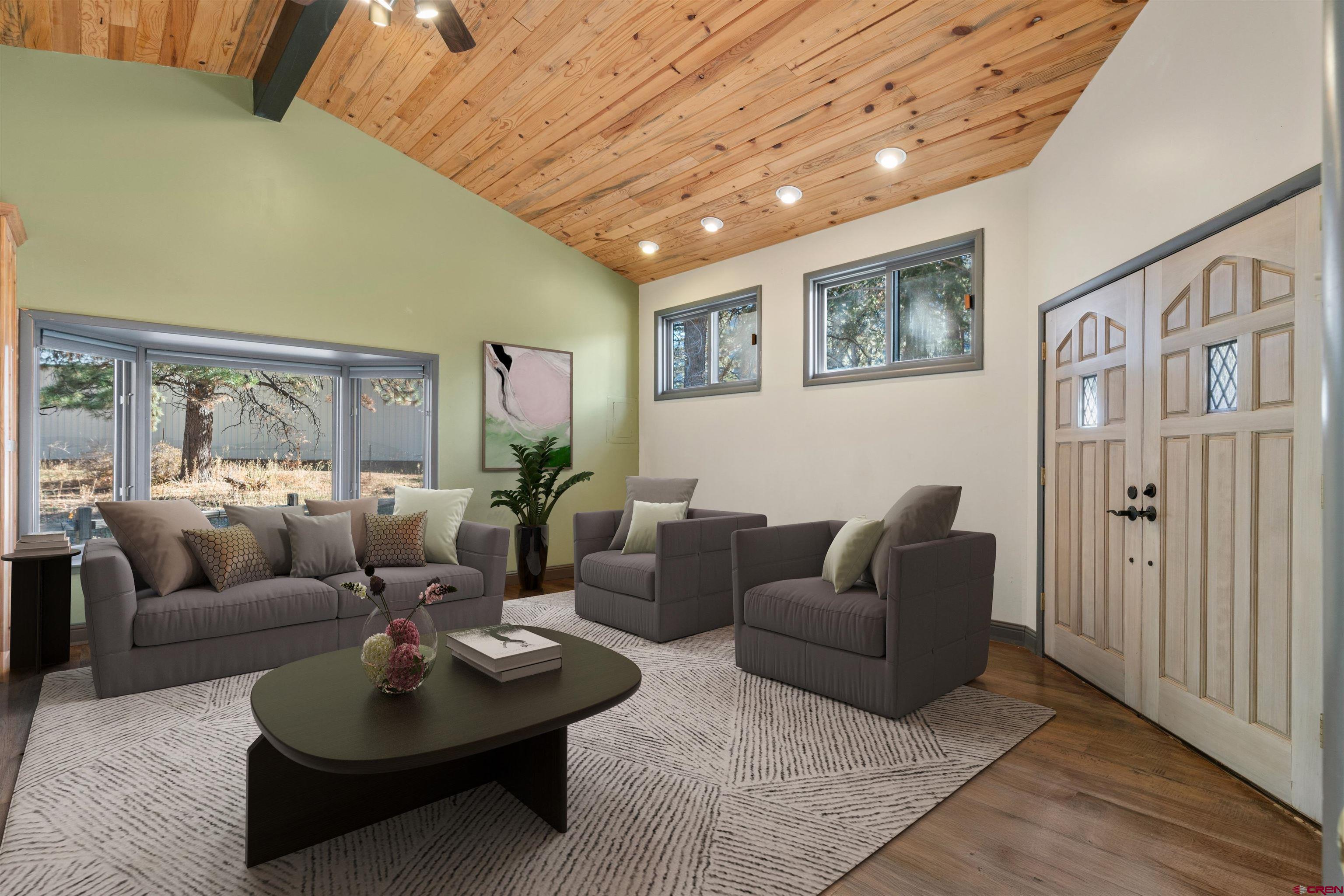 12199 County Road 240 Durango, CO 81301 - Photo 25 of 35 a living room with furniture and a wooden floor