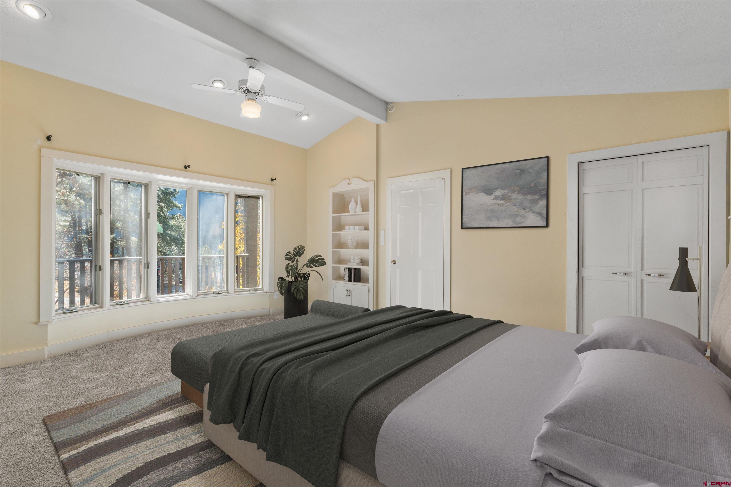 12199 County Road 240 Durango, CO 81301 - Photo 28 of 35 a bedroom with a large bed and a large window