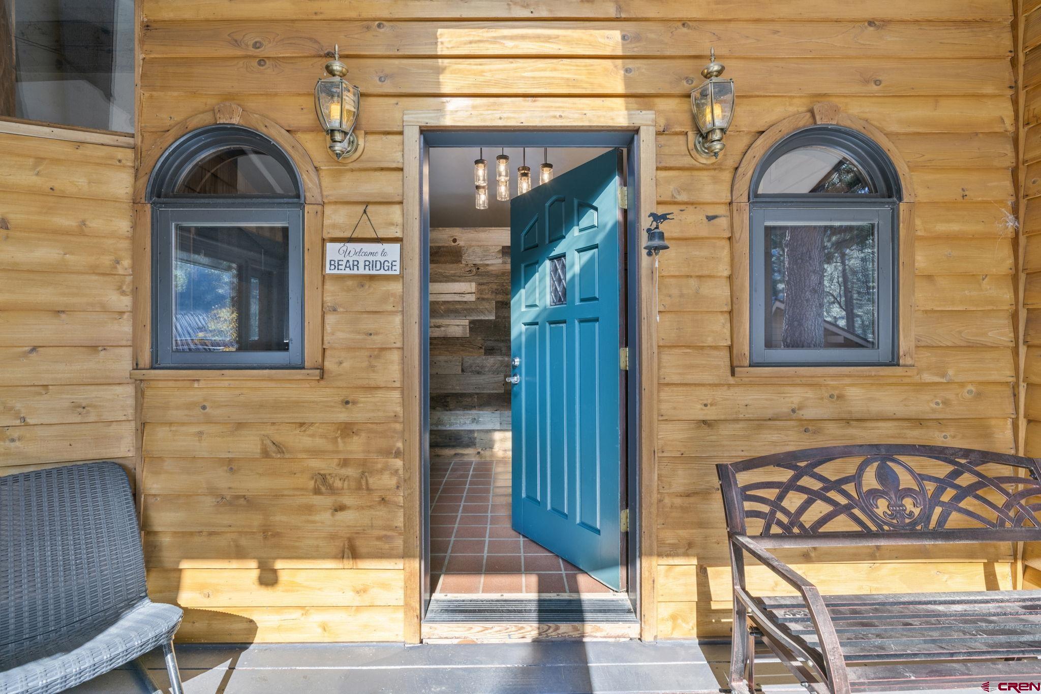 12199 County Road 240 Durango, CO 81301 - Photo 4 of 35 a view of a brick house with a bench