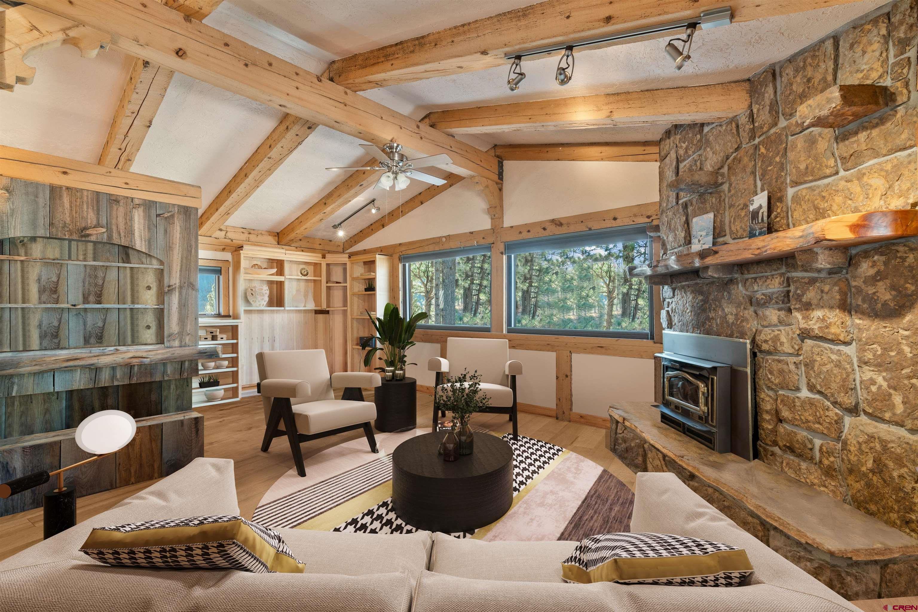 12199 County Road 240 Durango, CO 81301 - Photo 6 of 35 a living room with furniture and a fireplace