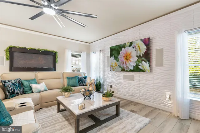 a living room with furniture and a painting on the wall