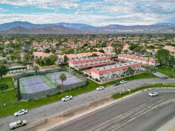 an aerial view of residential houses and outdoor space