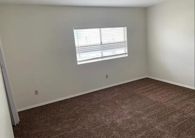 a bathroom with a toilet and a bathtub