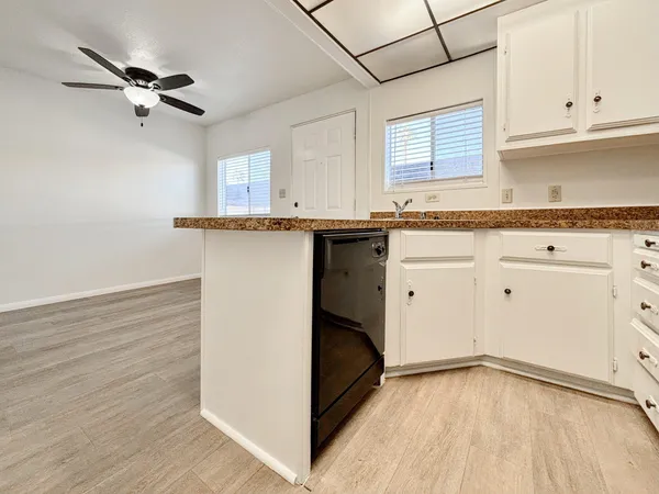 a kitchen with a refrigerator and window