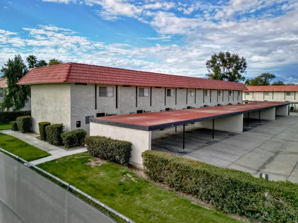 a view of a backyard with sitting area