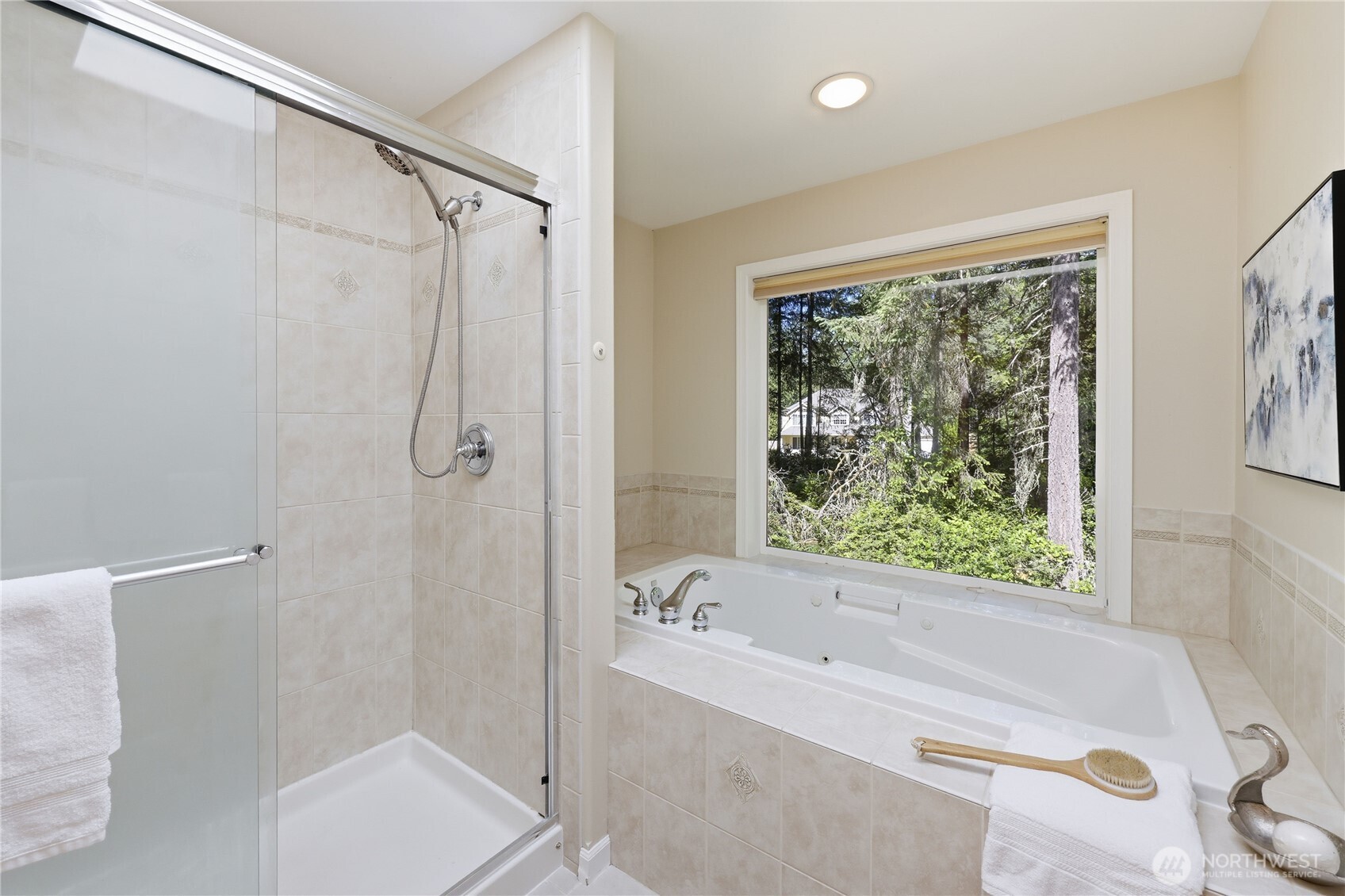 4354 Northwest Westgate Road Silverdale, WA 98383 - Photo 23 of 40 a bathroom with a bathtub and a shower