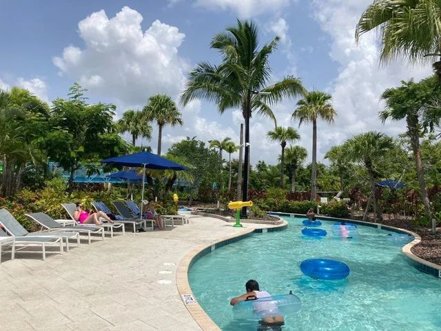 a view of a park with swings and slides