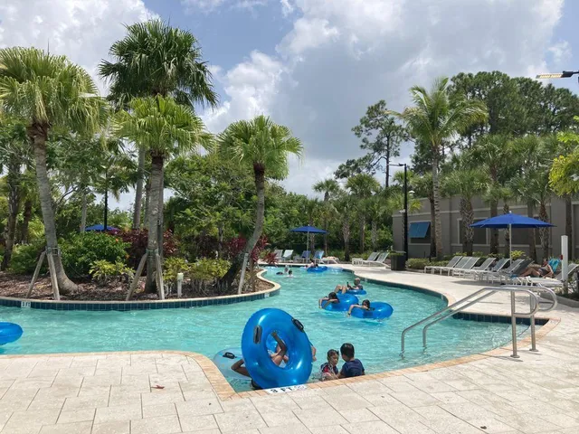 a view of a backyard with plants and outdoor seating