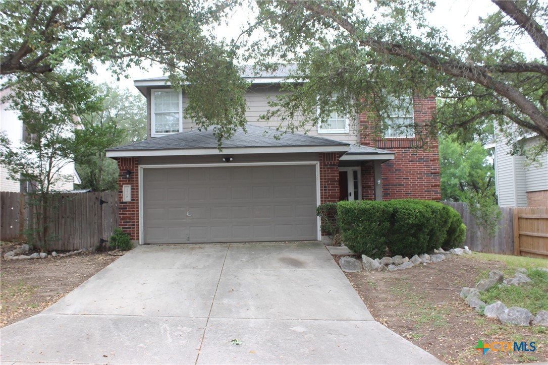 7710 Fallen Pine Converse, TX 78109 - Photo 1 of 19 a front view of a house with a garden and plants