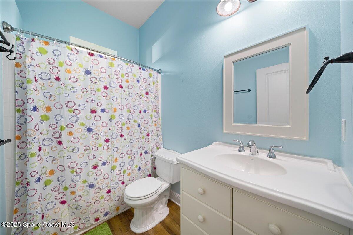 7831 Winona Road Melbourne Beach, FL 32951 - Photo 16 of 41 a bathroom with a sink toilet and shower