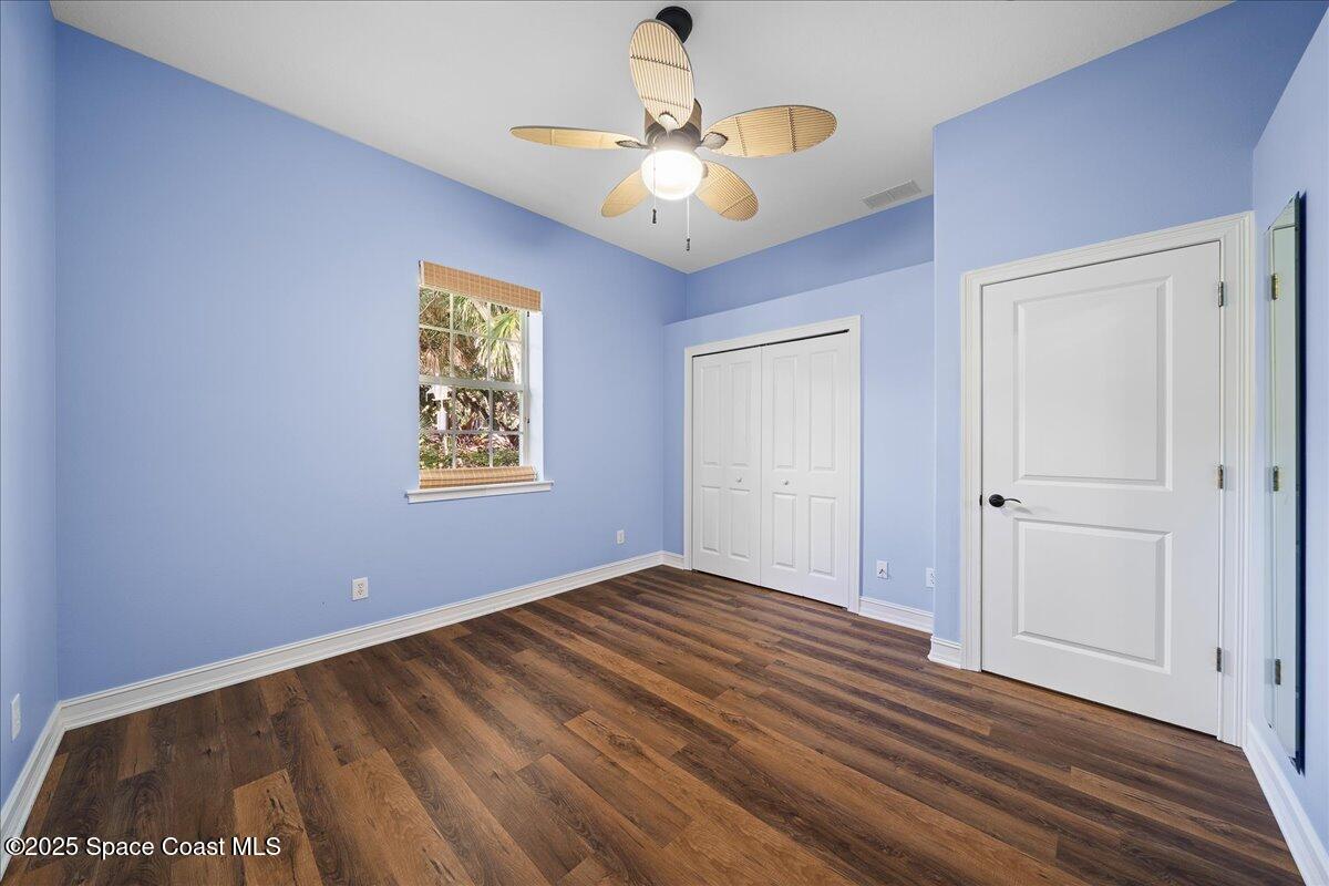 7831 Winona Road Melbourne Beach, FL 32951 - Photo 18 of 41 a view of an empty room with a chandelier fan