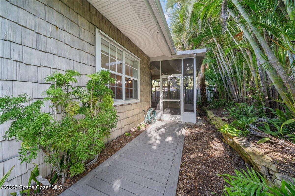 7831 Winona Road Melbourne Beach, FL 32951 - Photo 28 of 41 a front view of a house with a yard