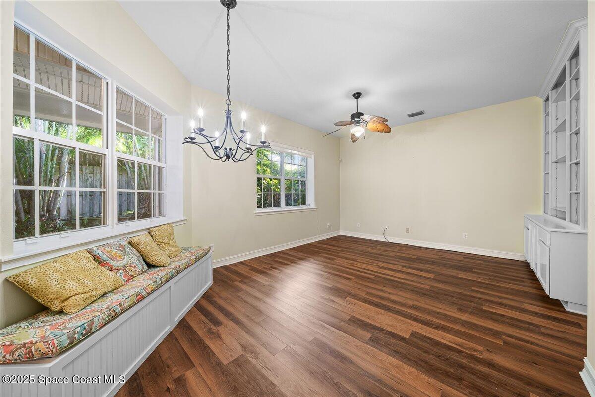 7831 Winona Road Melbourne Beach, FL 32951 - Photo 3 of 41 a view of a living room with a furniture and floor to ceiling window