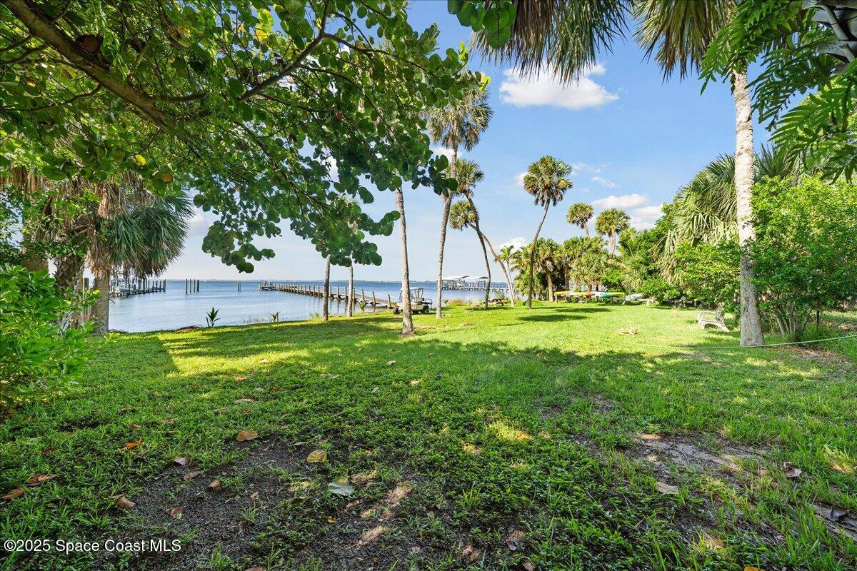 7831 Winona Road Melbourne Beach, FL 32951 - Photo 32 of 41 a view of swimming pool with a garden