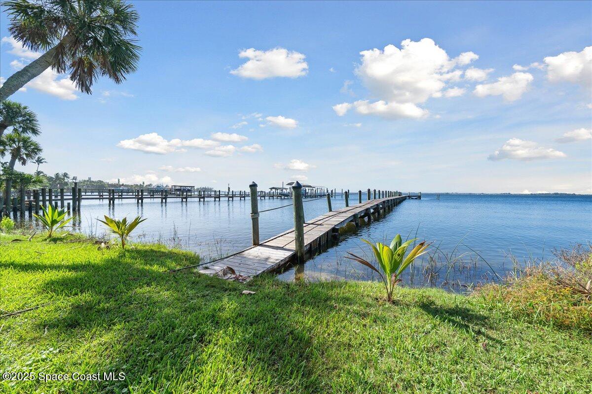 7831 Winona Road Melbourne Beach, FL 32951 - Photo 33 of 41 a view of a lake with a yard