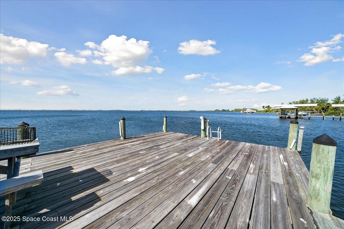 7831 Winona Road Melbourne Beach, FL 32951 - Photo 34 of 41 a view of a terrace with wooden floor