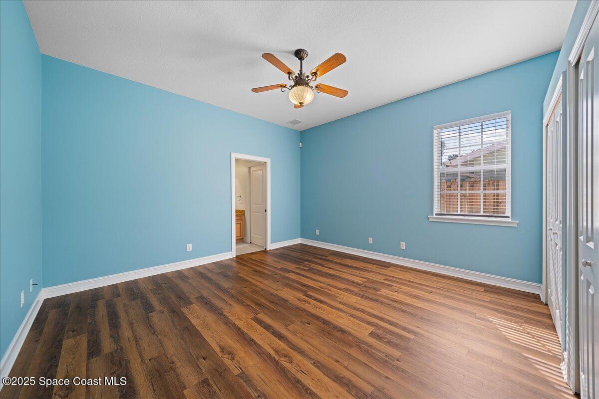 7831 Winona Road Melbourne Beach, FL 32951 - Photo 6 of 41 a view of a livingroom with a ceiling fan and window