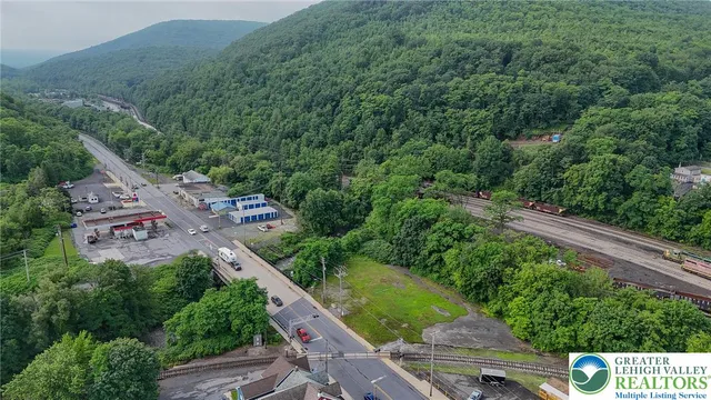an aerial view of a house with outdoor space