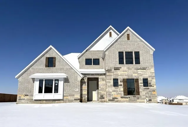 a front view of a house with yard