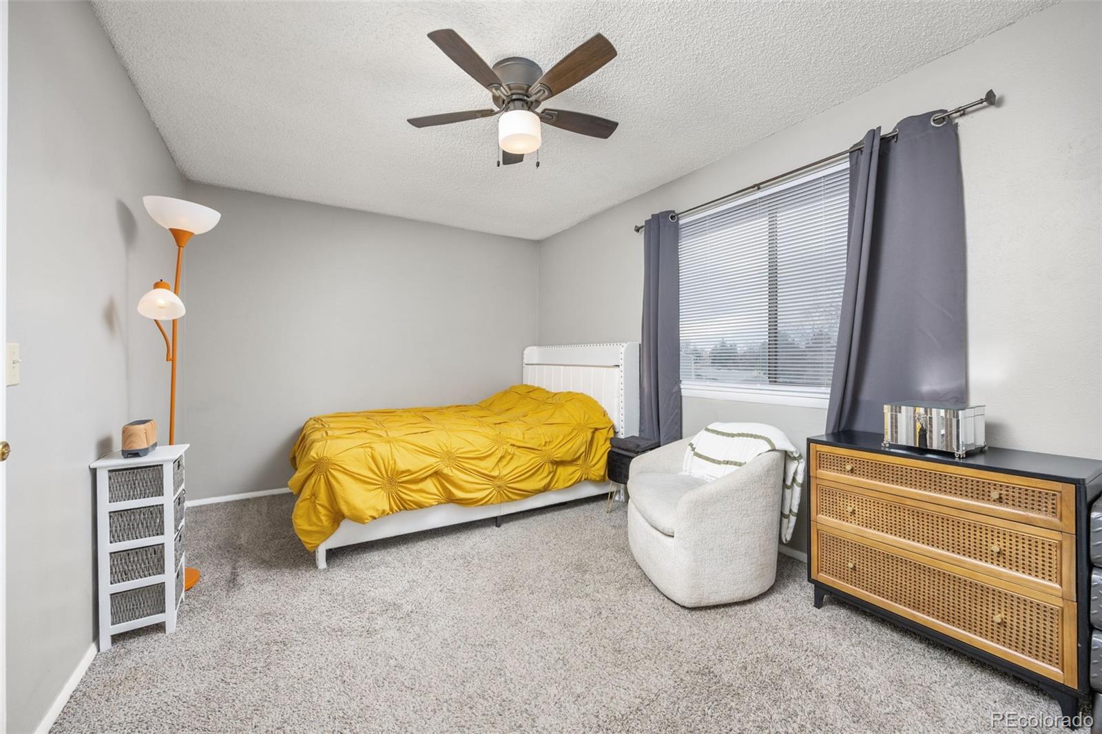 8782 Carr Loop Arvada, CO 80005 - Photo 11 of 23 a bedroom with a bed and a window