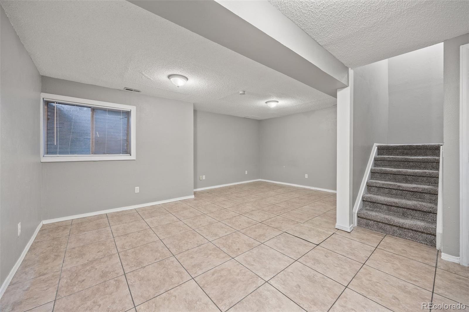 8782 Carr Loop Arvada, CO 80005 - Photo 16 of 23 a view of wooden floor and entryway in a room