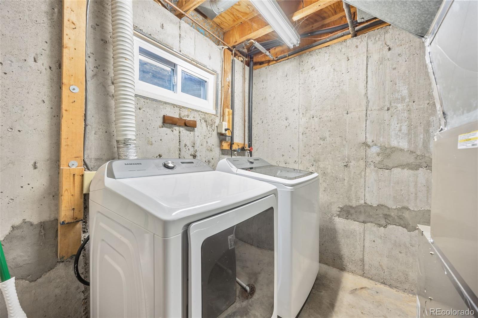 8782 Carr Loop Arvada, CO 80005 - Photo 17 of 23 a utility room with a washer and dryer
