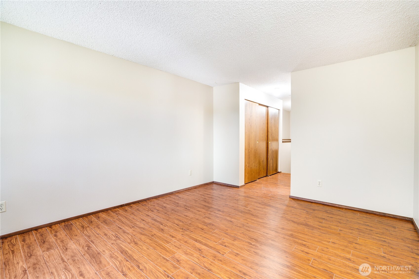 3023 Bridgeport Way West, Unit B University Place, WA 98466 - Photo 18 of 30 a view of an empty room with wooden floor