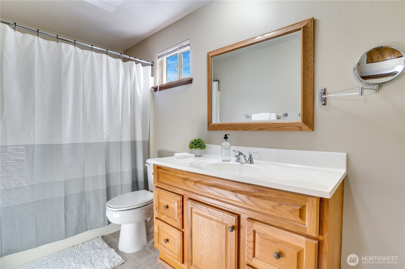 3023 Bridgeport Way West, Unit B University Place, WA 98466 - Photo 19 of 30 a bathroom with a sink toilet and shower