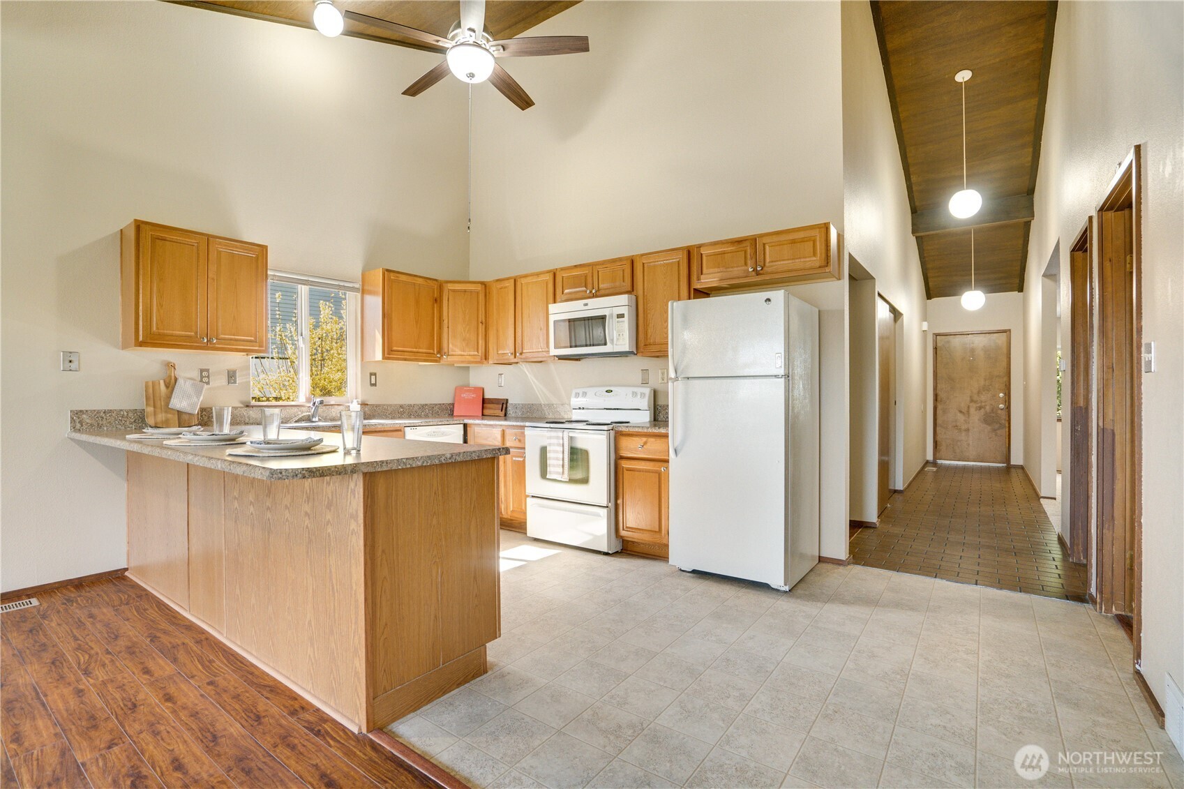 3023 Bridgeport Way West, Unit B University Place, WA 98466 - Photo 5 of 30 a kitchen with refrigerator cabinets and a sink