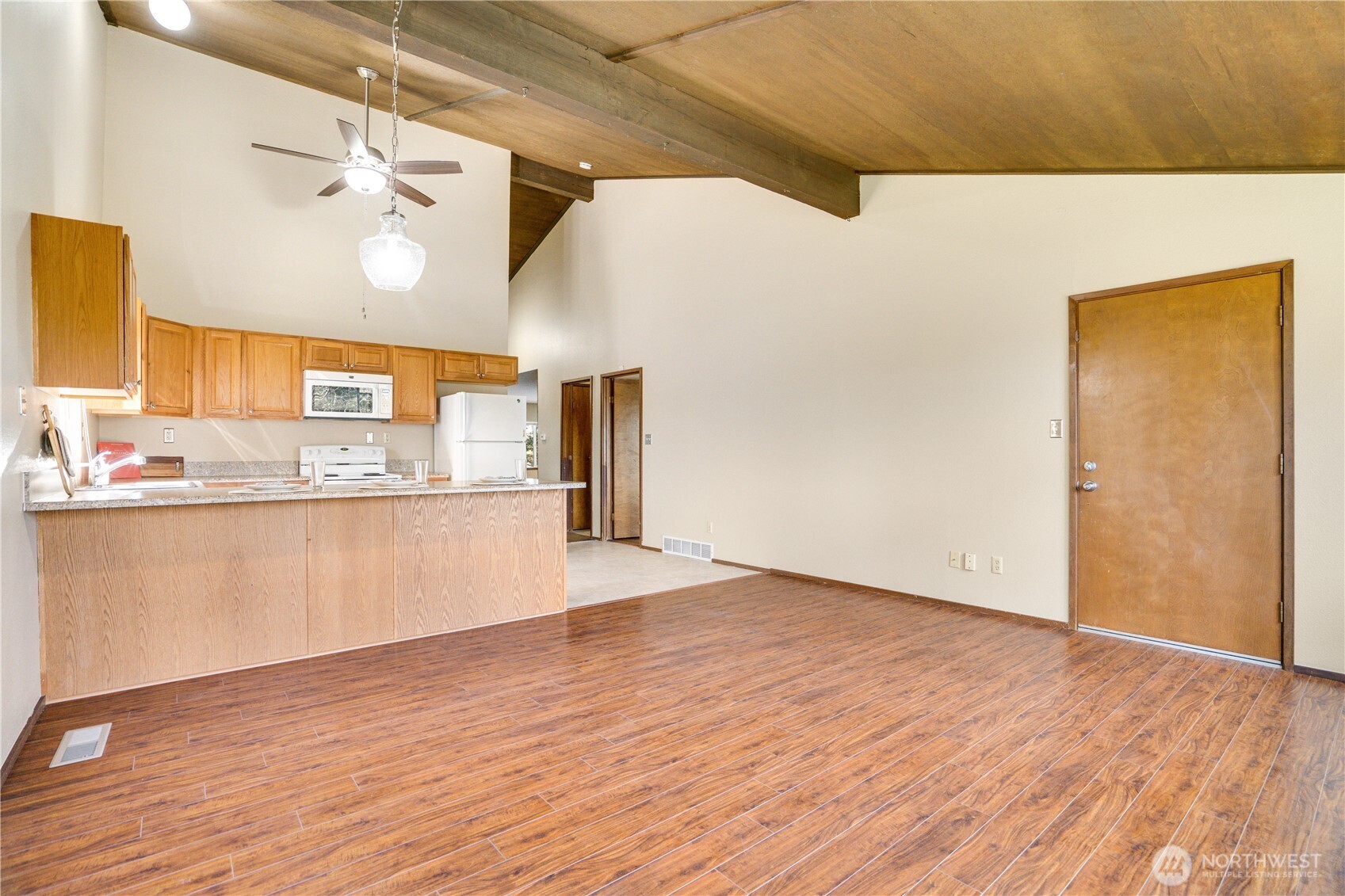 3023 Bridgeport Way West, Unit B University Place, WA 98466 - Photo 8 of 30 a view of a kitchen with wooden floor