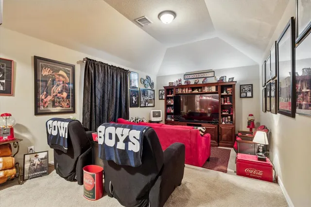 a spacious bedroom with a bed couch and windows