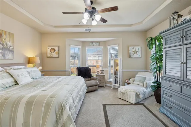 a bedroom with a bed and a couch