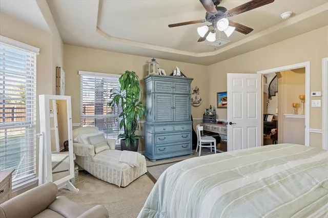a bath tub sitting next to a bathroom sink