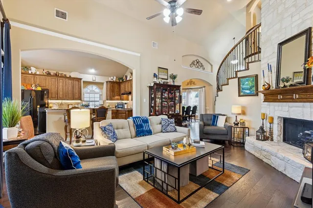 a living room with fireplace furniture and a fireplace