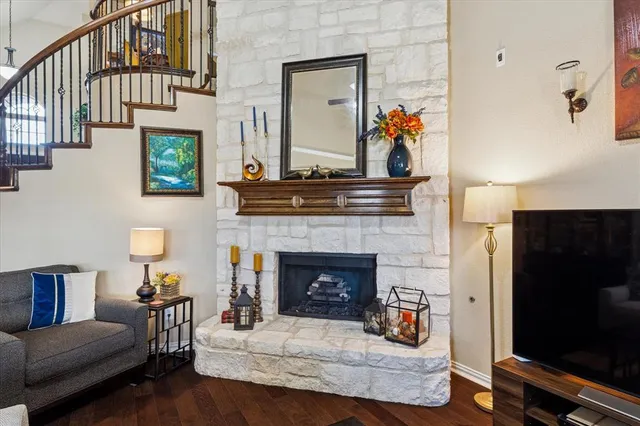 a dinning area with granite countertop a sink dishwasher a dining table and chairs with wooden floor