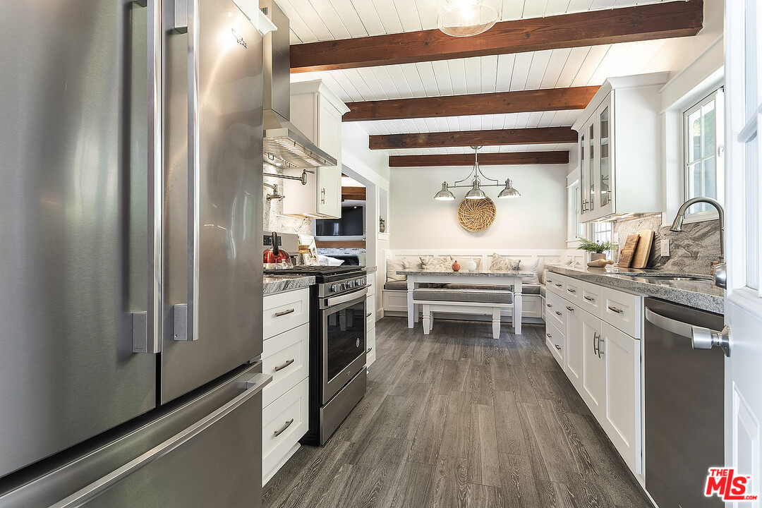 3908-a Las Flores Canyon Road Malibu, CA 90265 - Photo 22 of 60 a kitchen with a sink stove and refrigerator
