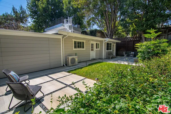a backyard of a house with seating space