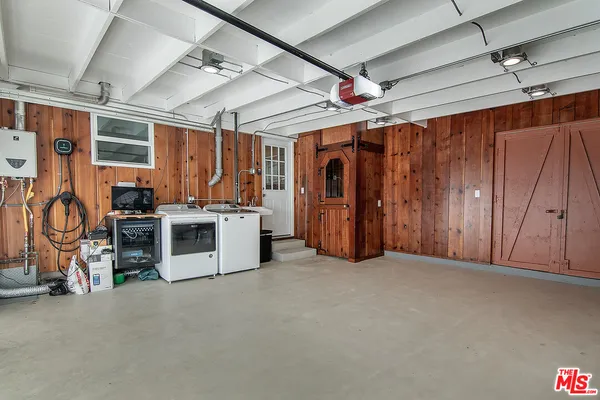 a view of a balcony with chairs and wooden floor
