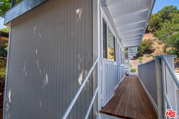 a view of a livingroom with workspace and a couch